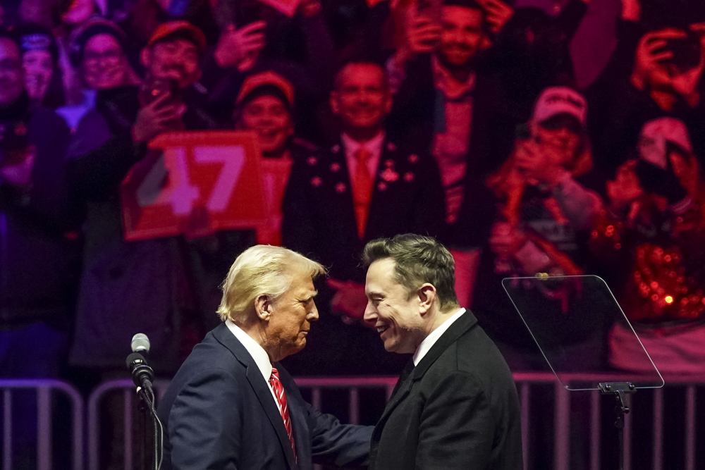 epaselect epa11837518 US President-elect Donald Trump (L) with businessman Elon Musk (R) on stage during a rally at Capital One Arena in Washington, DC, USA, 19 January 2025. President-elect Donald Trump, who defeated Joe Biden to become the 47th president of the United States, will be inaugurated on 20 January, though all of the planned outdoor ceremonies and events have been cancelled due to a forecast of extreme cold temperatures. EPA/WILL OLIVER