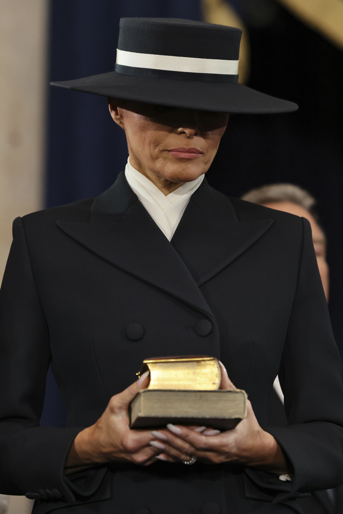 WASHINGTON, DC - JANUARY 20: First lady Melania Trump holds two Bibles during inauguration ceremonies in the Rotunda of the U.S. Capitol on January 20, 2025 in Washington, DC. One Bible was given to President Donald Trump by his mother when he was a child, and the Lincoln Bible was used at Abraham Lincoln's 1861 inauguration, Donald Trump takes office for his second term as the 47th president of the United States. Credit: Chip Somodevilla/Pool via CNP