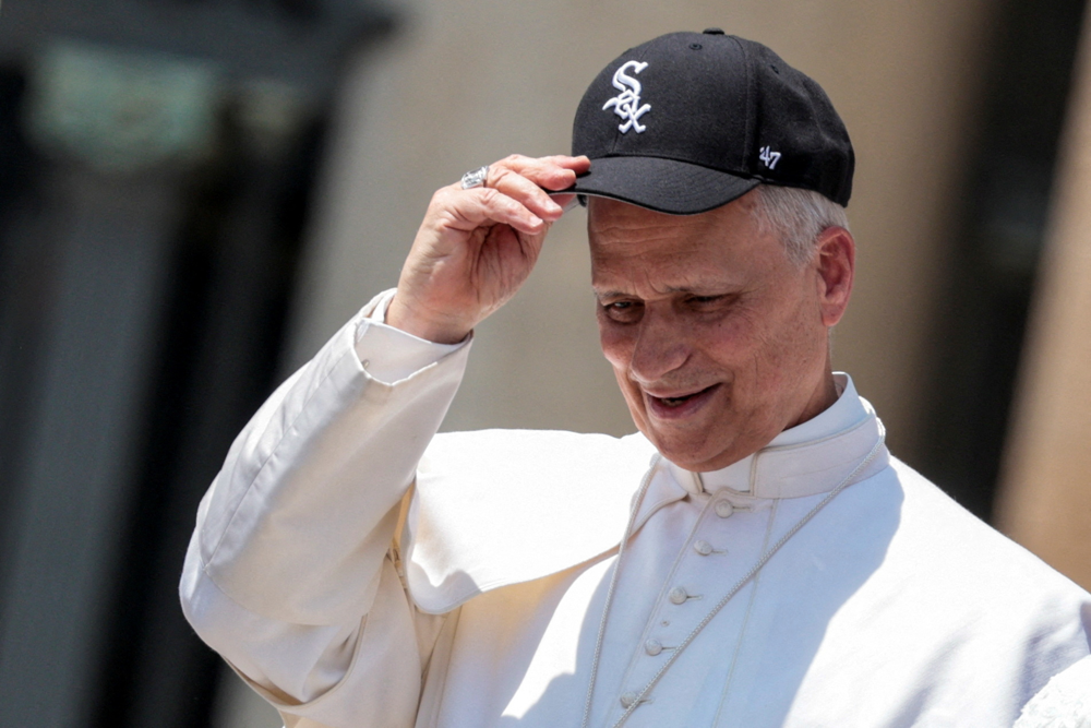 FILE PHOTO: Pope Leo XIV wears a Chicago White Sox cap, on the day of his general audience in St. Peter's Square, at the Vatican June 11, 2025. REUTERS/Remo Casilli    TPX IMAGES OF THE DAY/File Photo